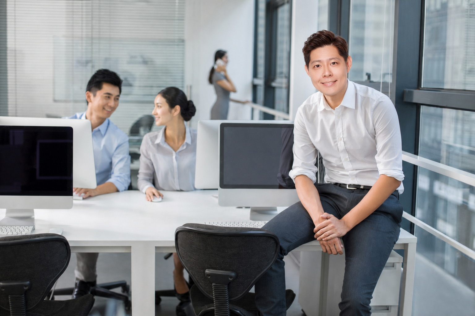 Bluehive advisory team collaborating in a modern Singapore office