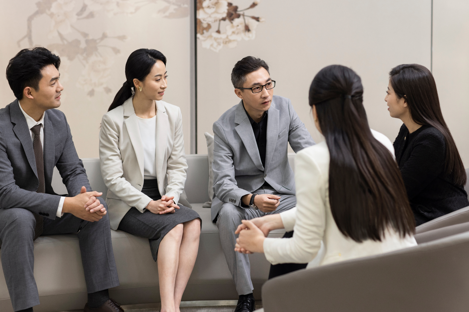 Business leaders in an executive discussion around a boardroom table